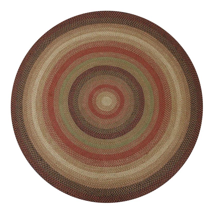 Round woven rug with concentric circle pattern on a white background