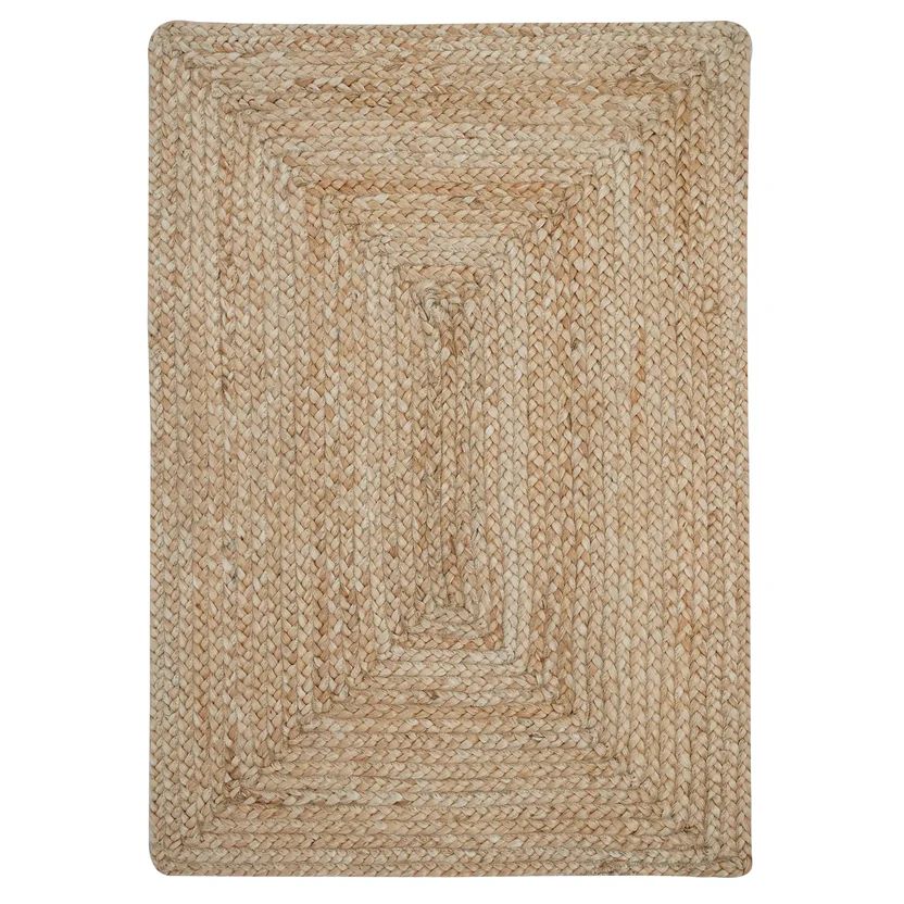 Beige braided rug on a white background